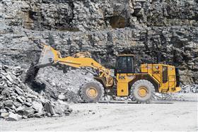 Hilltop Quarry: A Caterpillar 988K sorts material in the pit. 