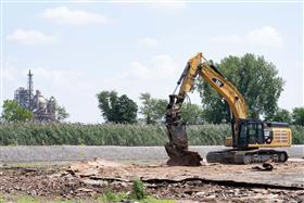 Demolition: A Caterpillar 349F uses a tool to process scrap metal.