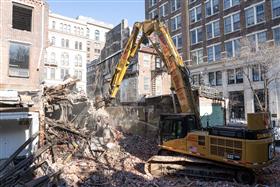 Demolition: A Caterpillar 345C works on a selective demolition job. 