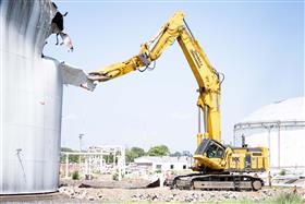 Demolition: A Komatsu PC1250 dismantles a fuel storage tank.